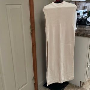 Floor length sleeveless sweater vest. New without tags.